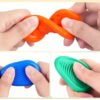 Spalvoti silikoniniai sensoriniai akmenėliai Fidget Toys – 6 vnt.